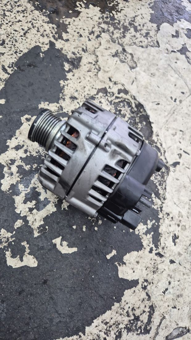 A worn alternator removed from a car